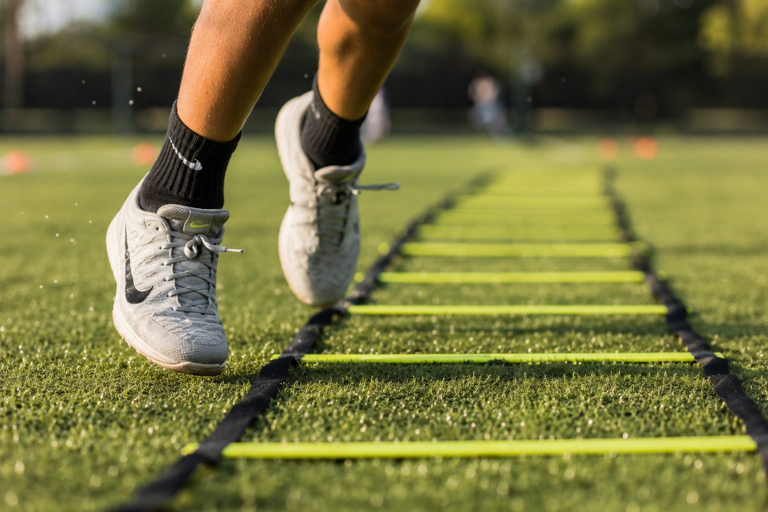 Youth athlete on agility ladder
